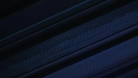 A metallic black background with parallel lines, creates high-tech concept Stock Photos