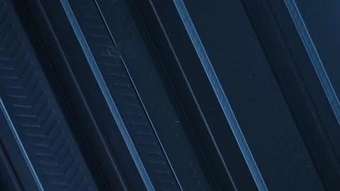 A metallic black background with parallel lines, creates high-tech concept Stock Photos