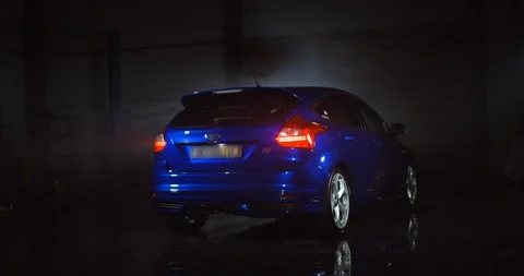 Metallic blue Ford Focus ST-Line hatchback with blured logo. Shot on 6K RED Stock Footage 111254565