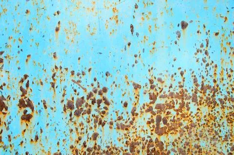 Metallic blue texture with rusty splashes. Close-up. Stock Photos