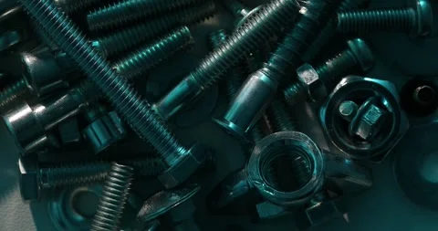 Metallic Bolts and Nuts with Cool Blue Lighting Stock Footage 293370370