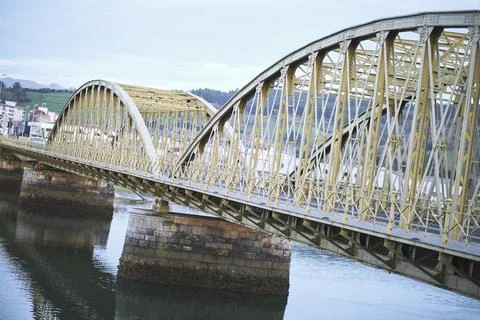 Metallic bridge over river. Stock Photos