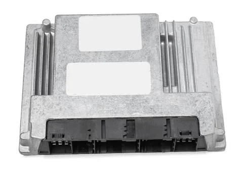 Metallic car engine control unit with plastic elements on a white isolated ba Stock Photos