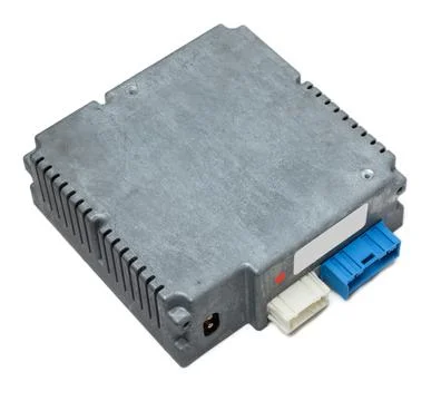 Metallic car engine control unit with plastic elements on a white isolated ba Stock Photos