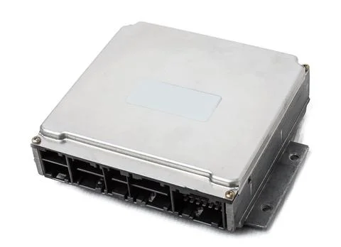 Metallic car engine control unit with plastic elements on a white isolated ba Stock Photos