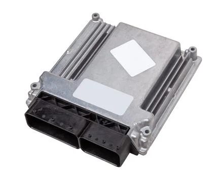 Metallic car engine control unit with plastic elements on a white isolated ba Stock Photos