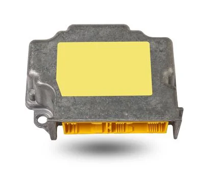 Metallic car engine control unit with plastic elements soaring on a white iso 스톡 사진