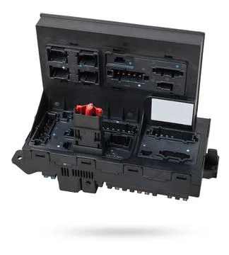 Metallic car engine control unit with plastic elements soaring on a white i.. 스톡 사진