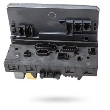 Metallic car engine control unit with plastic elements soaring on a white i.. Stock Photos