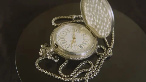 Metallic chain and silver case of a vintage watch. Stock Footage 327687259