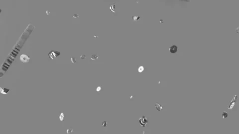 Metallic coins floating through air against solid grey background motion Stock Footage 345210374