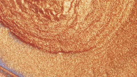 Metallic Copper particles over purple. Some patterns caused by brownian motion Stock Footage 132249190