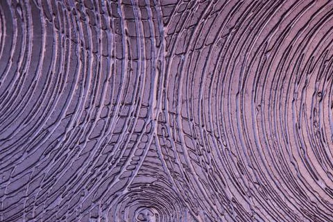 Metallic design surface with circular pattern of violet lilac paint. Texture  Stock Photos