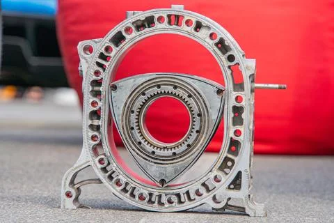 A metallic engine or transmission component is centered in the frame, showcas Stock Photos