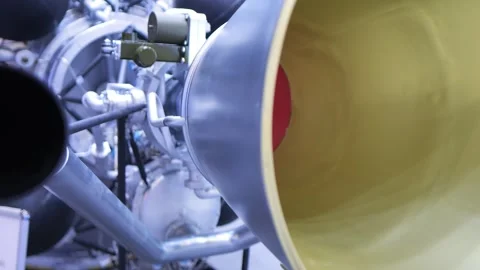 Metallic engine parts, pipes, and yellow cone in close-up Stock Footage 345377746