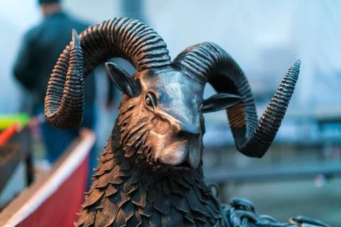 The metallic head of ram. The statue head aries. Stock Photos
