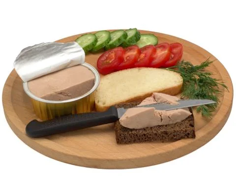 Metallic jar with poultry paste, bread with paste, vegetables on a wooden board Stock Photos