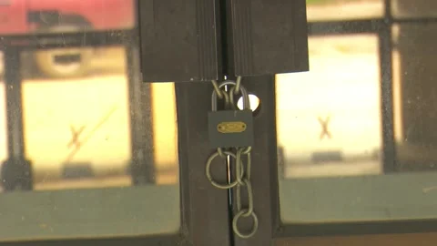 Metallic Lock Hanging on Door Stock Footage 321465724