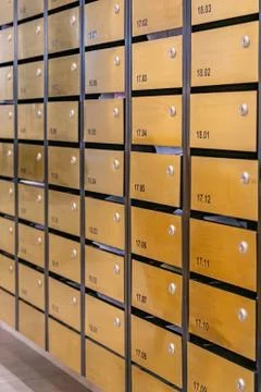 Metallic mailbox array in postal room of condominium building Foto stock