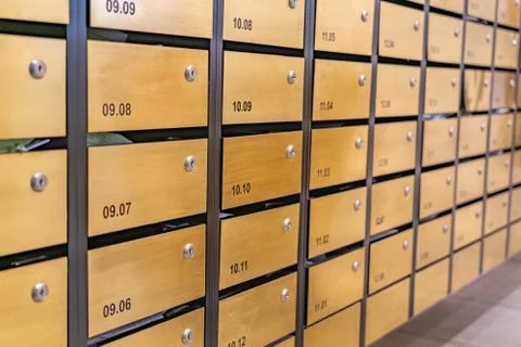 Metallic mailbox array at postal room inside modern apartment building Foto stock