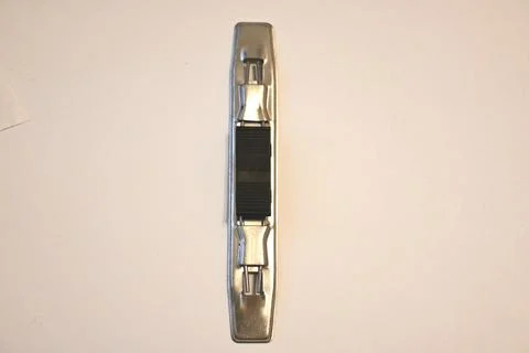 Metallic mechanical object with black textured center Stock Photos