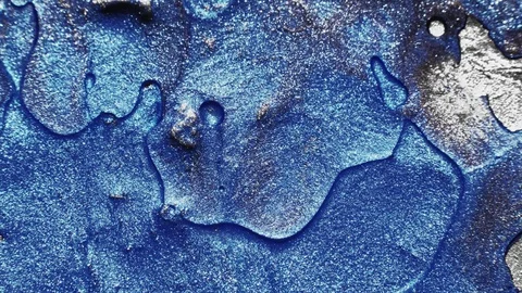 Metallic paint texture glitter blue fluid flow Stock Footage 128498358