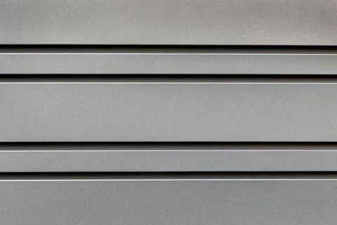 Metallic Panel Texture with Horizontal Lines. A close-up of a metallic panel Stock Photos