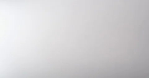 Metallic paperclips dropping onto a white surface, piling up Stock Footage 117349882