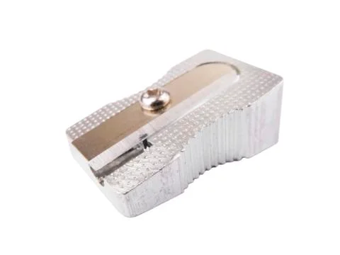 Metallic pencil sharpener on a white background. Stock Photos