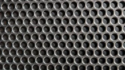 Metallic Perforated Surface with Circular Pattern 写真素材