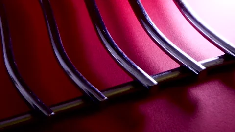 Metallic rods with shadows on dark red background Stock-Footage 251186006