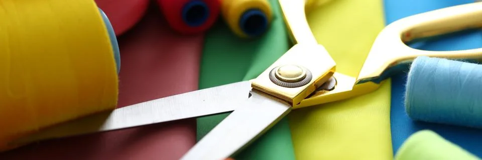 Metallic scissors on table Stock Photos
