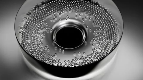 Metallic silver balls fall and collect in a hole in the center. 3D render. Stock Footage 255142599
