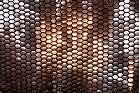 Metallic silver shinny sequin pattern texture bg with warm reflection Stock Photos