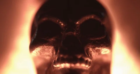 Metallic skull bathed in red light with moving shadows Stock Footage 117351089