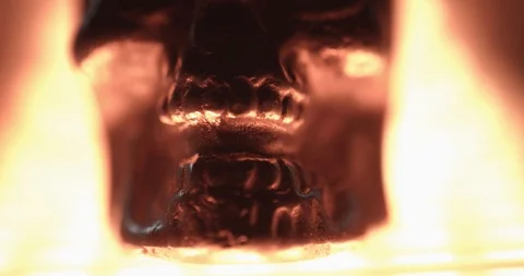 Metallic skull on a bright light source Stock Footage 117351120