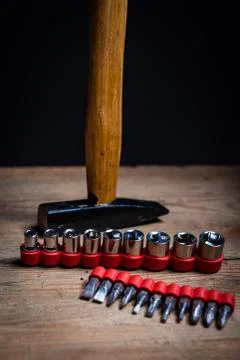 Metallic socket spanner inserts and a hammer Stock Photos