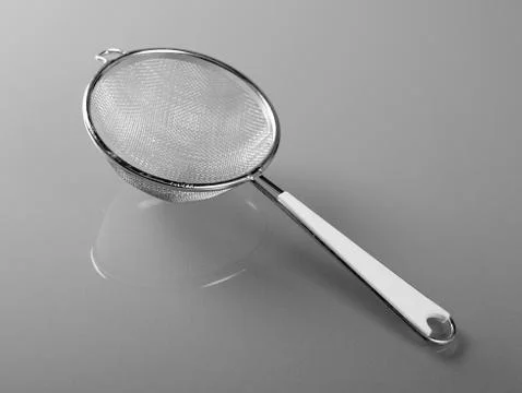 Metallic strainer with plastic handle Fotos de archivo