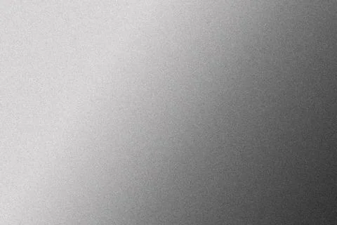 A metallic surface displays a smooth gradient transitioning from light to dar Stock Photos