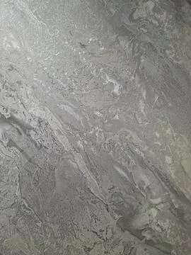 Metallic texture background showing a silver surface with wavy patterns and.. Stock Photos