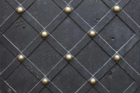 Metallic texture black elements of the old door. Stock Photos