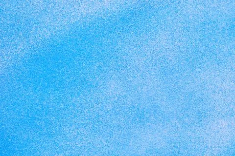 Metallic texture with paint sprayed on it with white and blue. Stock Photos