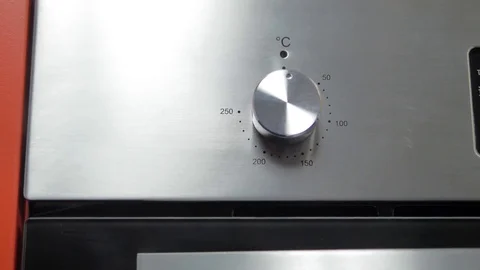 Metallic Toggle Switch of the Cooker Oven. Close-up View. Digital Clock of oven. Stock Footage 84830724