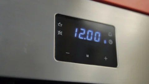 Metallic Toggle Switch of the Cooker Oven. Close-up View. Digital Clock of oven. Stock Footage 84830726