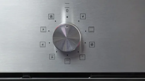 Metallic Toggle Switch of the Cooker Oven. Close-up View. Digital Clock of oven. Stock Footage 84830845