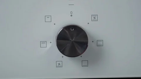 Metallic Toggle Switch of the Cooker Oven. Close-up View. Digital Clock of oven. Stock Footage 84830891