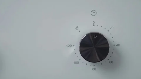 Metallic Toggle Switch of the Cooker Oven. Close-up View. Digital Clock of oven. Stock Footage 84830892