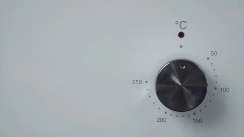 Metallic Toggle Switch of the Cooker Oven. Close-up View. Digital Clock of oven. Stock Footage 84830909