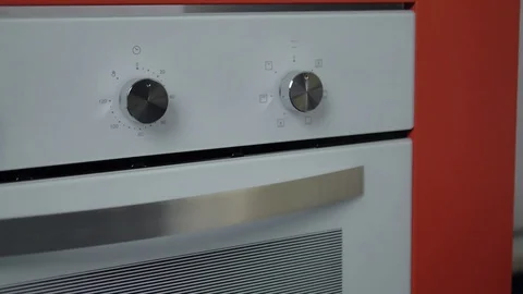 Metallic Toggle Switch of the Cooker Oven. Close-up View. Digital Clock of oven. Stock Footage 84830950