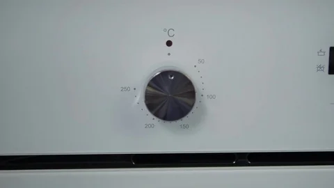 Metallic Toggle Switch of the Cooker Oven. Close-up View. Digital Clock of oven. Stock Footage 84830983